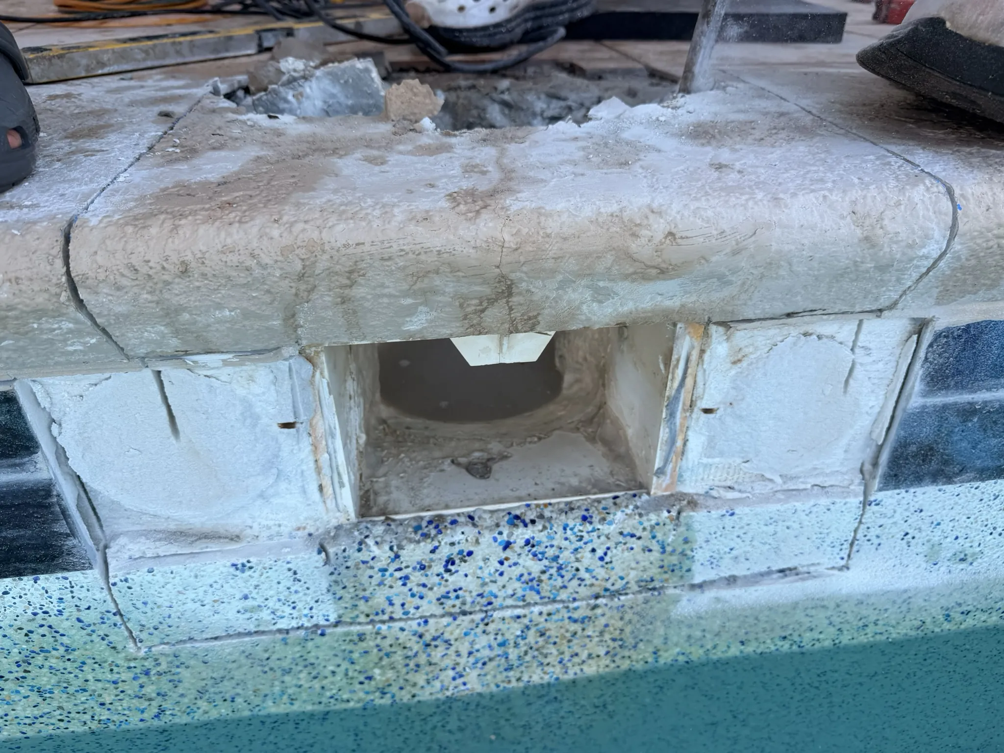 Coping and deck tile removed to reach the failed pool skimmer — Daytona Beach, FL