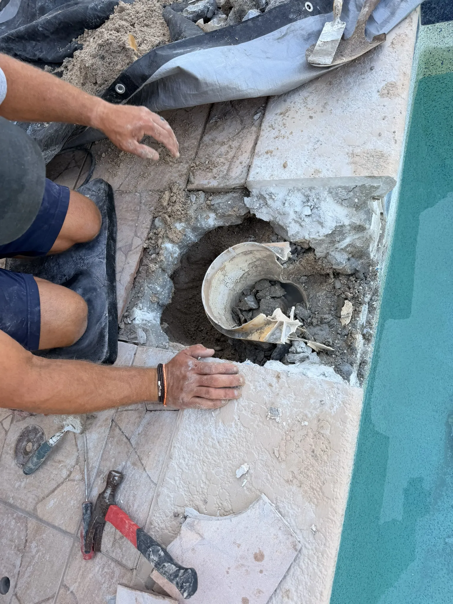Old cracked skimmer body being chipped out of the pool wall — Daytona Beach, FL