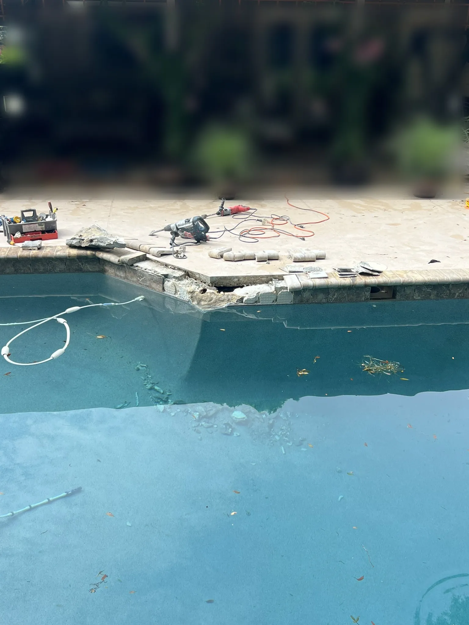 Cracked pool bond beam corner opened up for repair — Longwood, FL