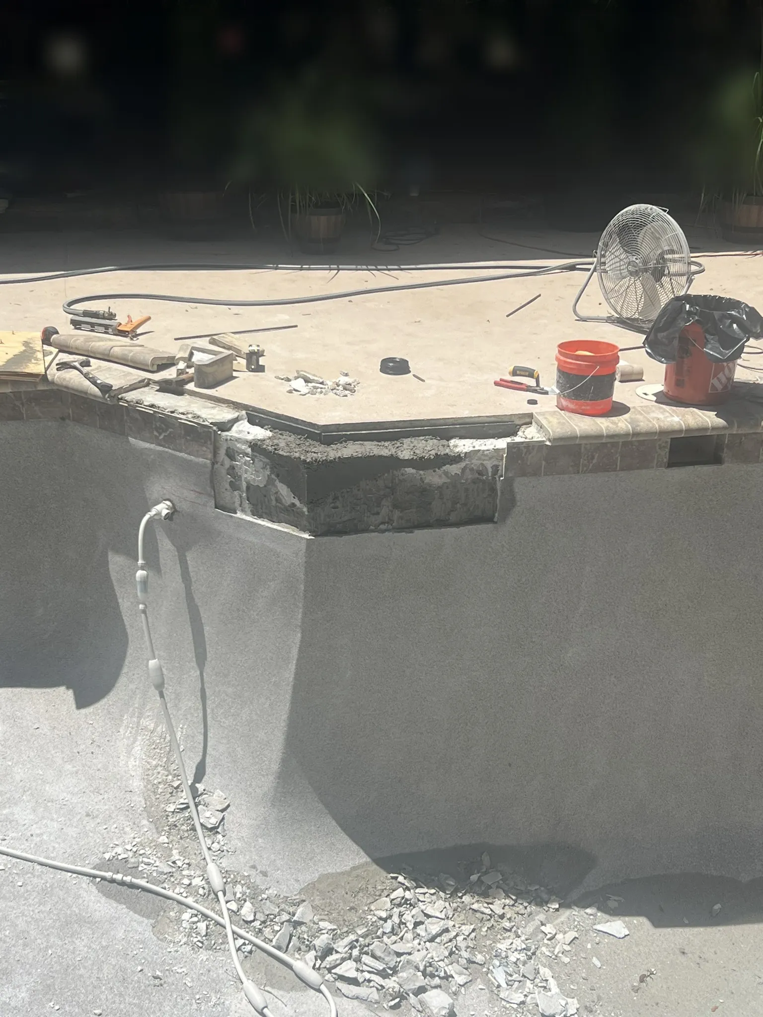Original coping and water line tile reset on the rebuilt beam — Longwood, FL