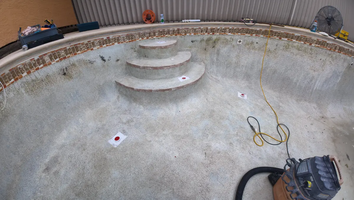 Drained pool with all four floor jet pockets waterproofed and filled — Ormond Beach, FL