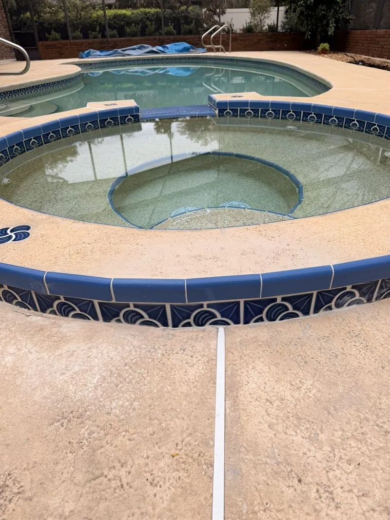 Raised spa beam rebuilt, retiled, and refinished after the pipe repair — Ormond Beach, FL