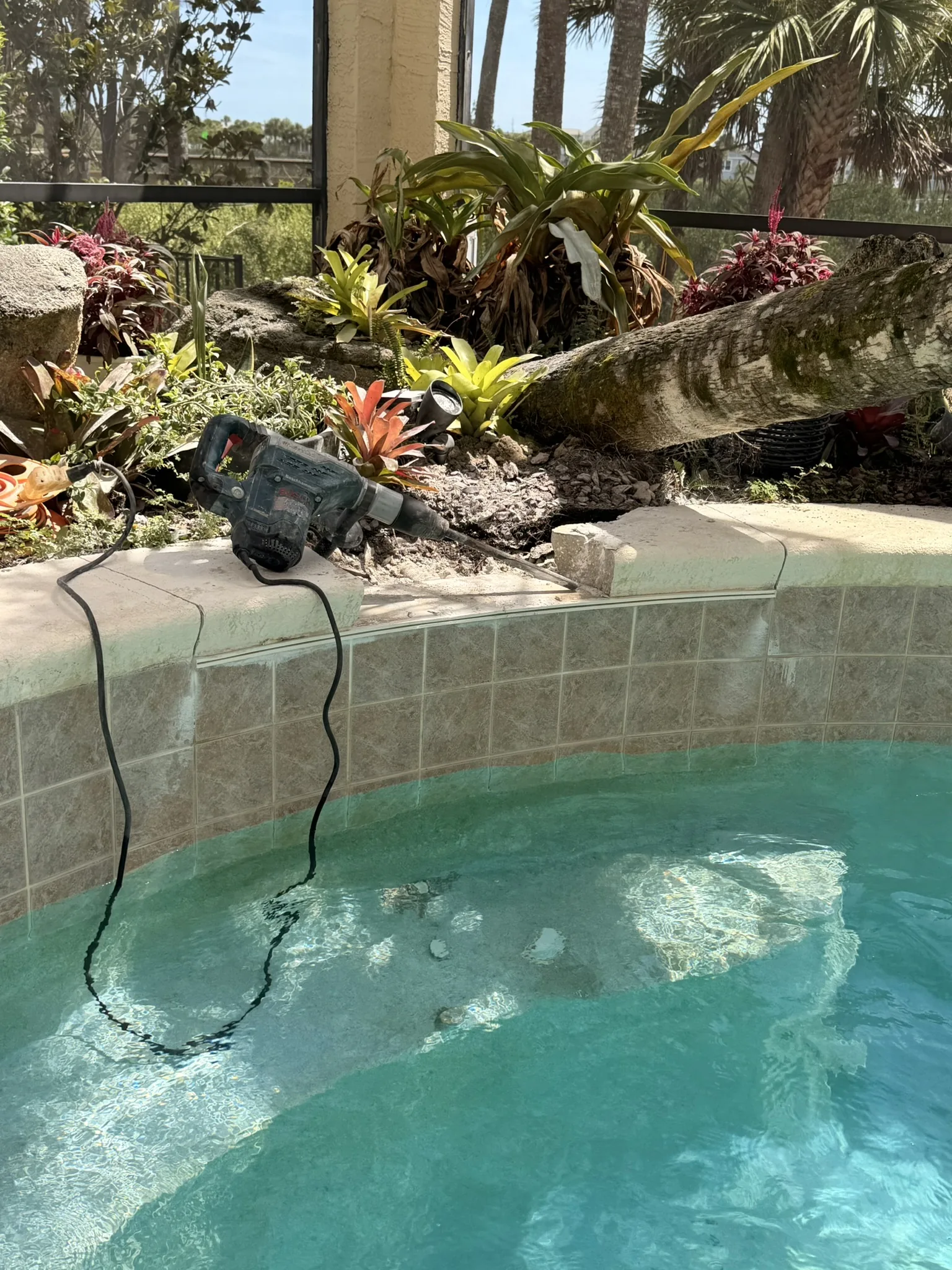 Leaking 4-ft sheer descent waterfall set into the raised pool beam — Palm Coast, FL