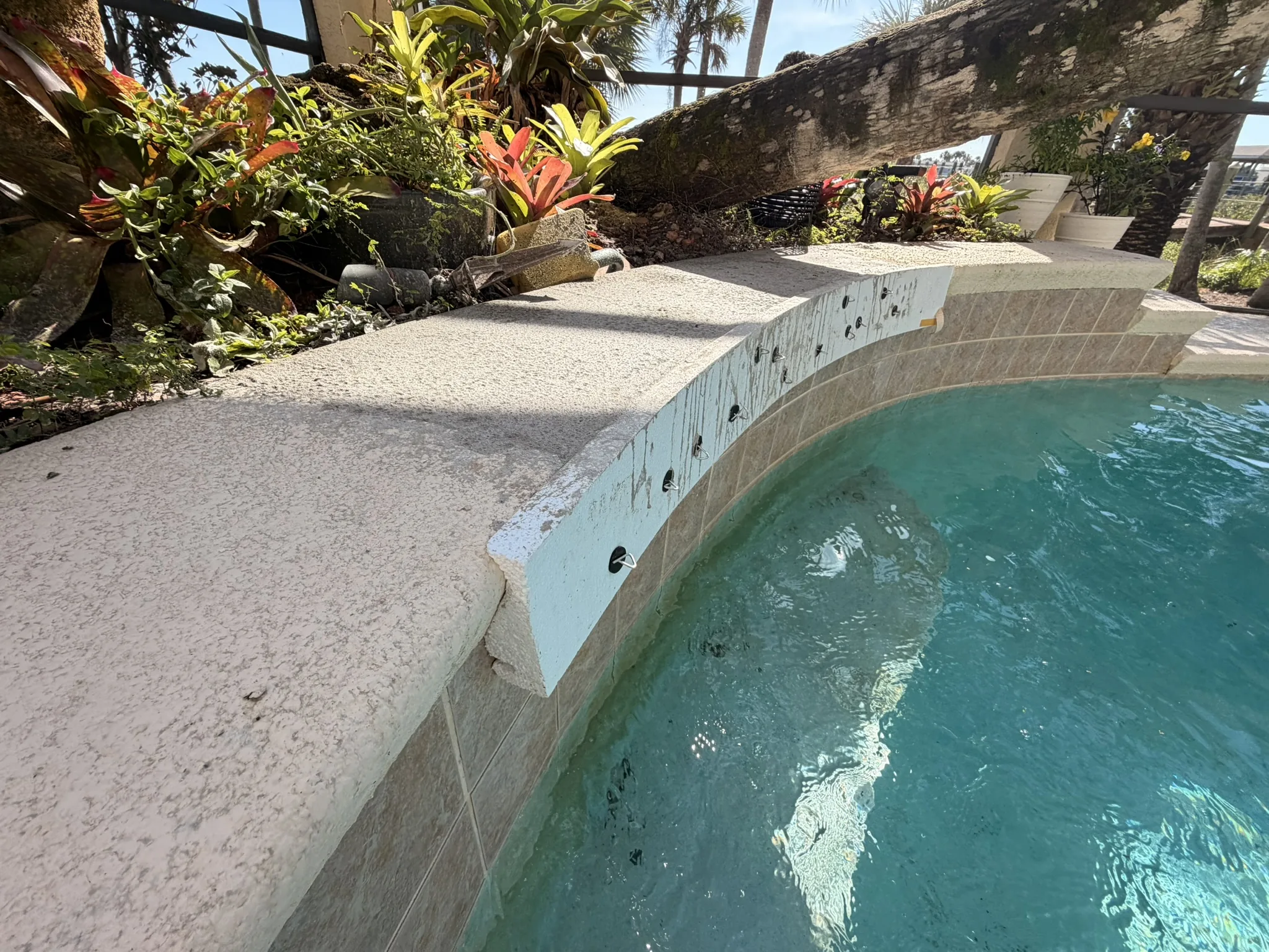 New sheer descent spillway anchored into the beam face — Palm Coast, FL